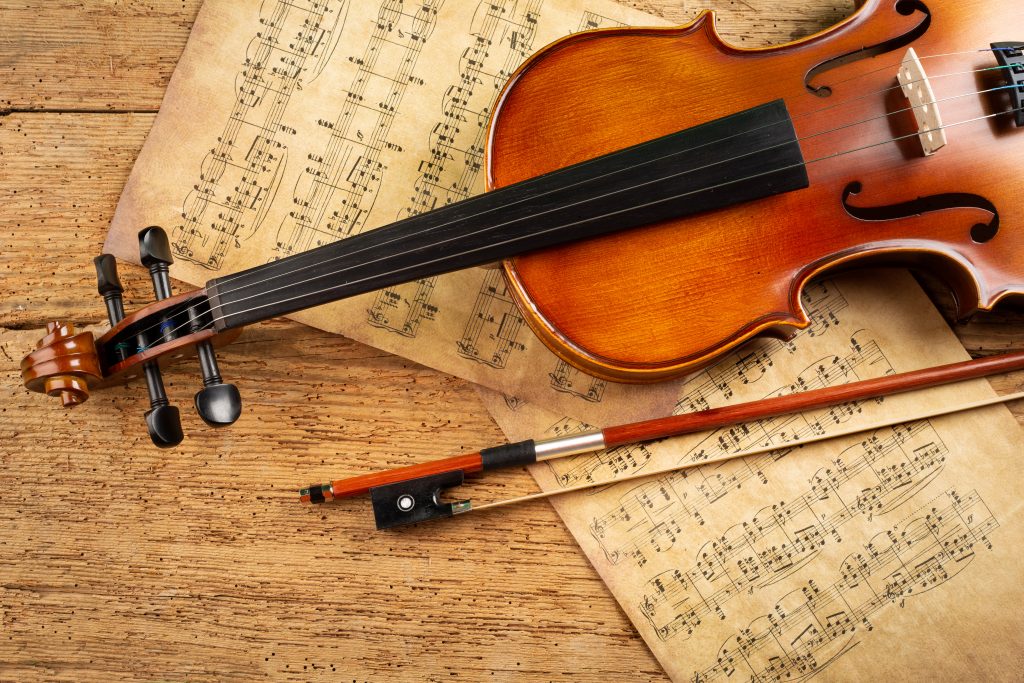 classic retro violin music string instrument with old music notes